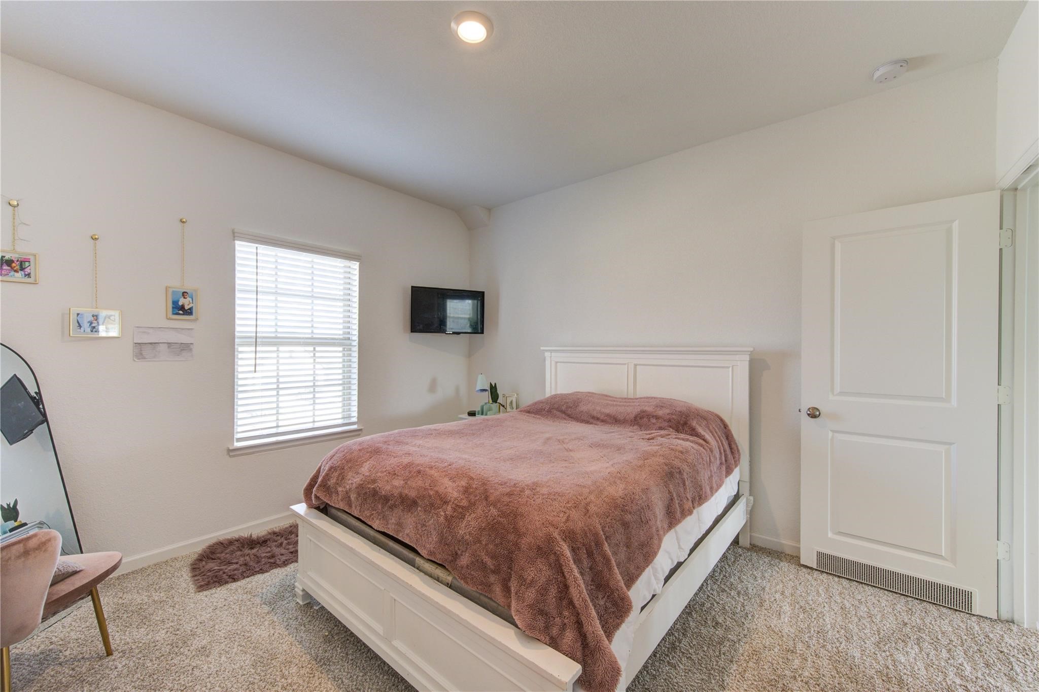 17530 Sunset Skies Road Conroe, TX 77302 - Photo 39 of 47 a bedroom with a bed and window