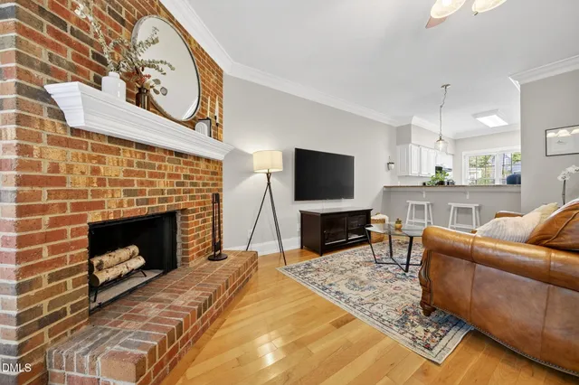 a spacious bedroom with a bed and a chandelier