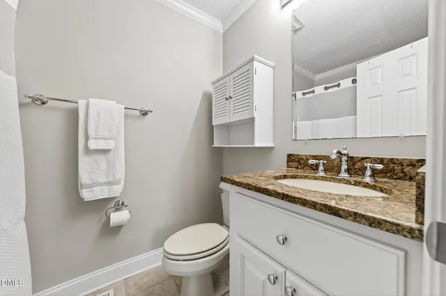 a view of a two chairs in the patio