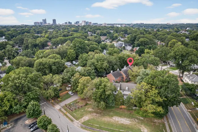 a kitchen with granite countertop a sink and a refrigerator