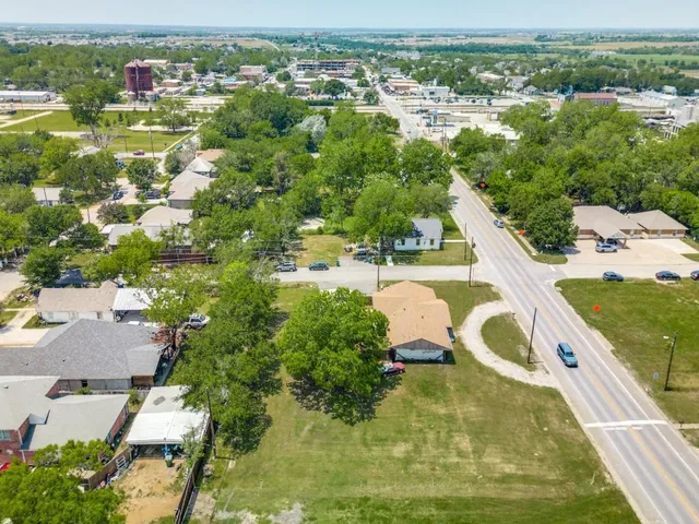 an aerial view of residential houses with outdoor space