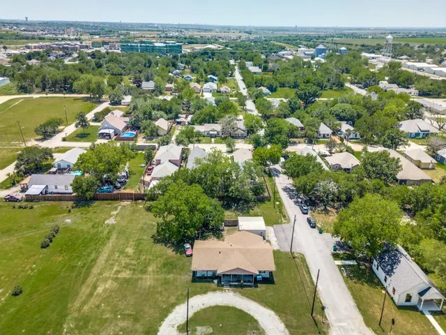 an aerial view of residential house with outdoor space