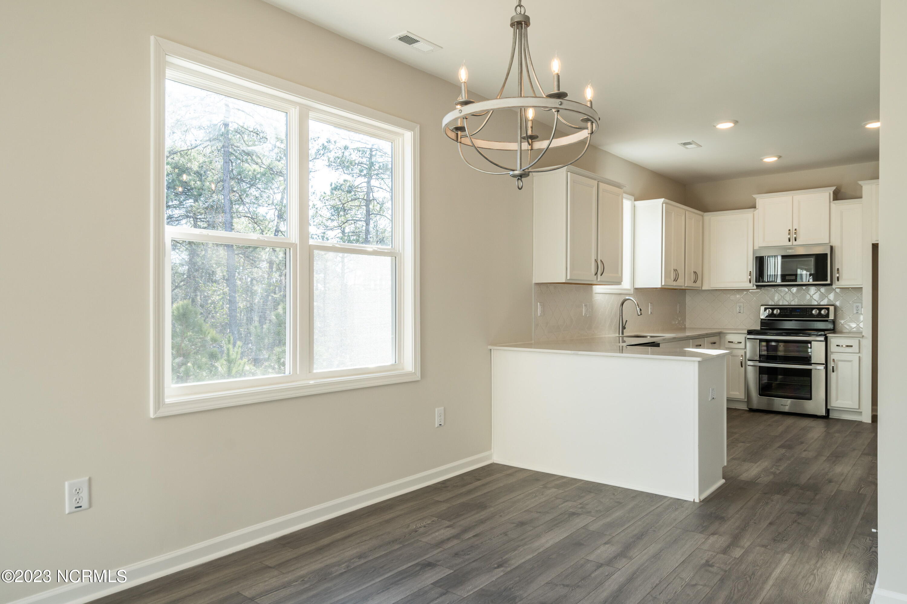 8807 Colbert Pl Drive Leland, NC 28451 - Photo 13 of 32 014-original-dining-room