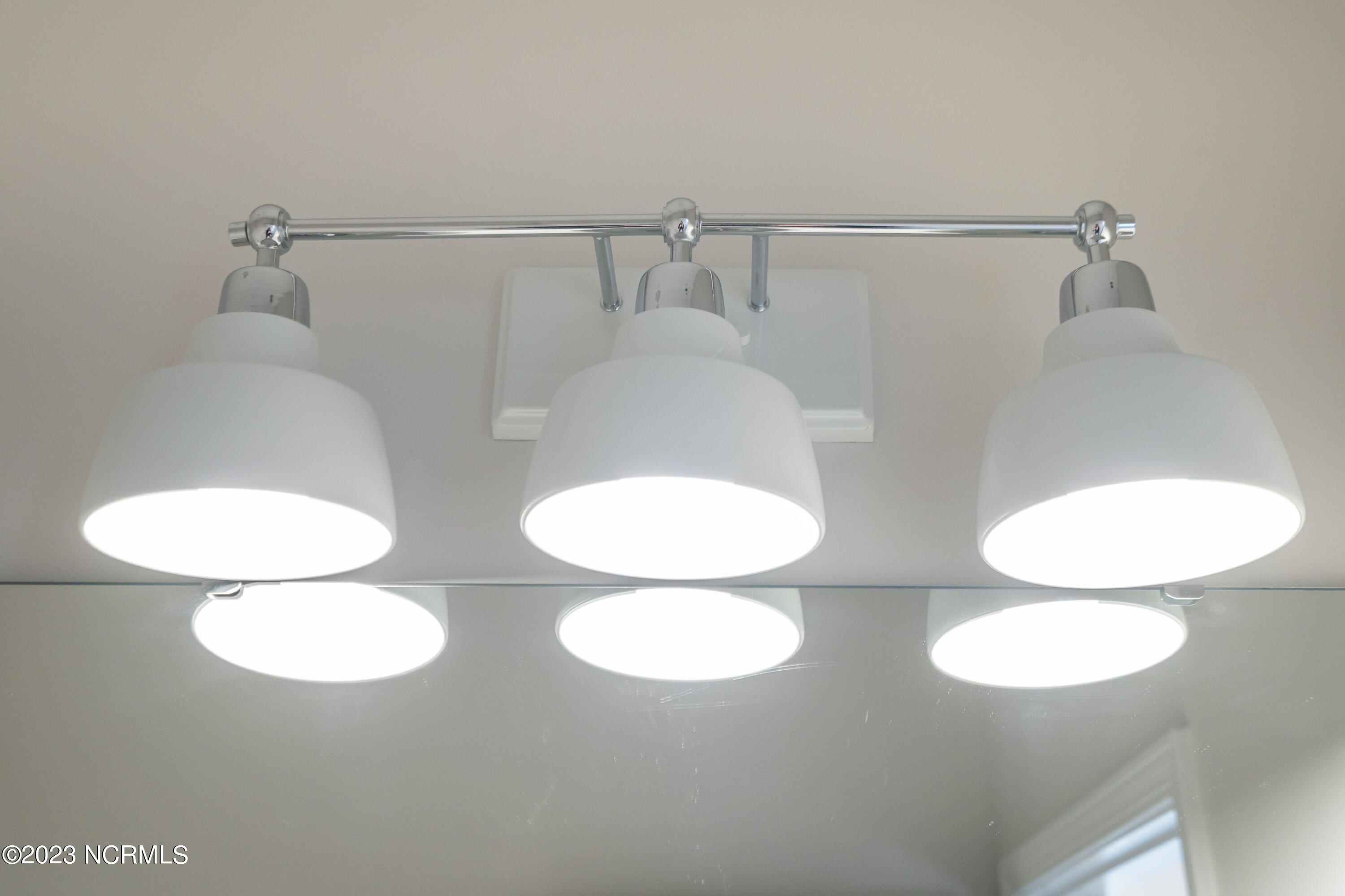 8807 Colbert Pl Drive Leland, NC 28451 - Photo 31 of 32 036-original-bathroom-lights