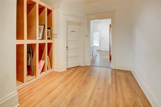 view of wooden floor and windows in a room