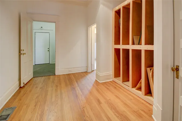 wooden floor with a bedroom