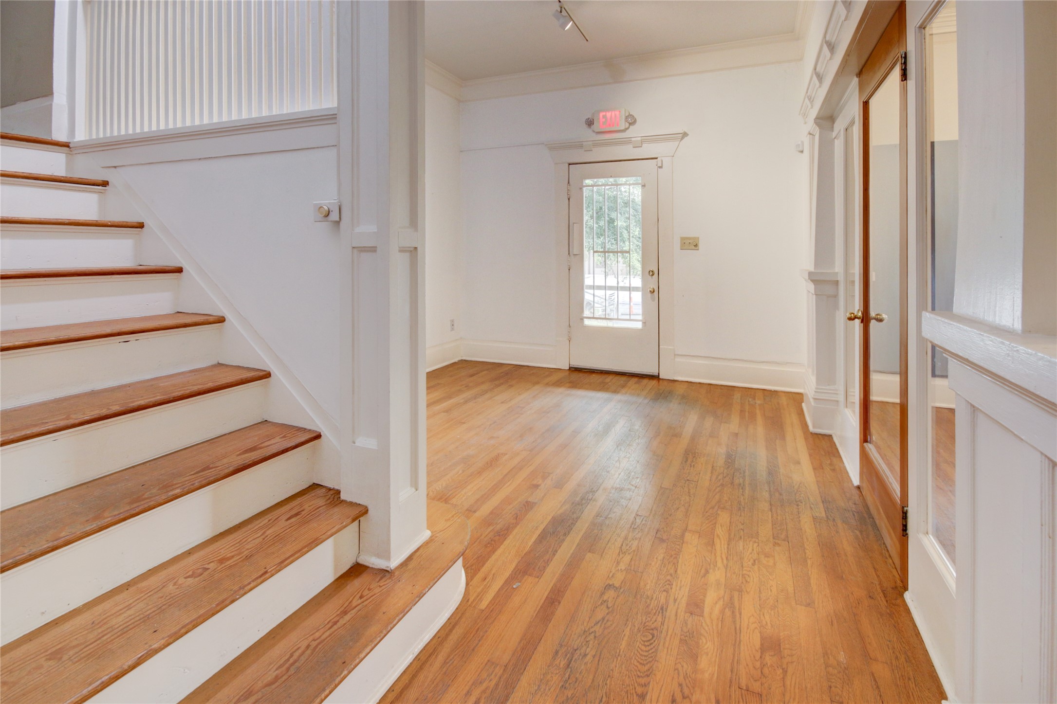 239 Westheimer Road Houston, TX 77006 - Photo 19 of 50 a view of entryway with wooden floor and stairs