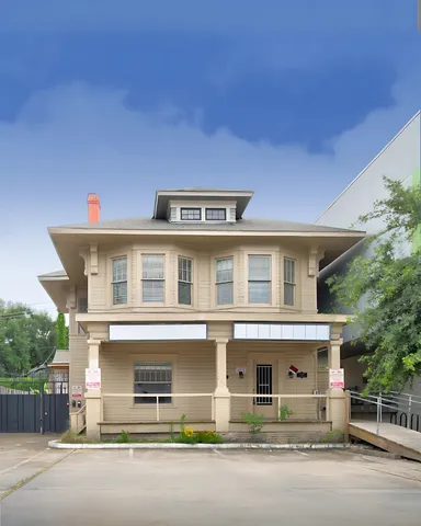 a front view of a house with a road