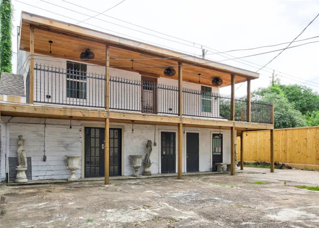 a front view of a building with a garden