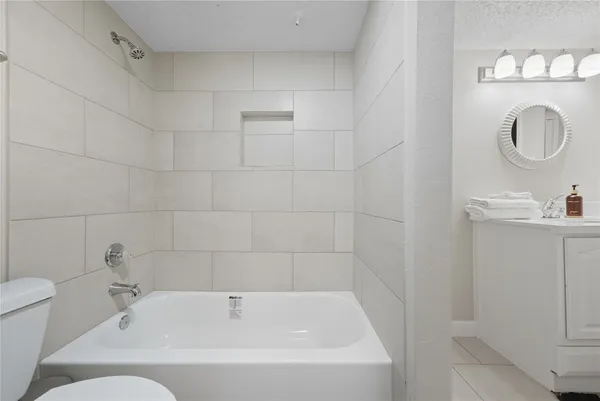 a bathroom with a bathtub and a sink