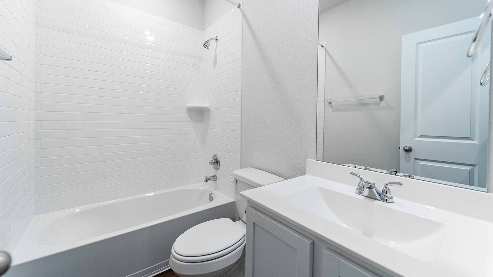 1539 Windrose Bend Angleton, TX 77515 - Photo 11 of 13 a bathroom with a sink a toilet and a bathtub