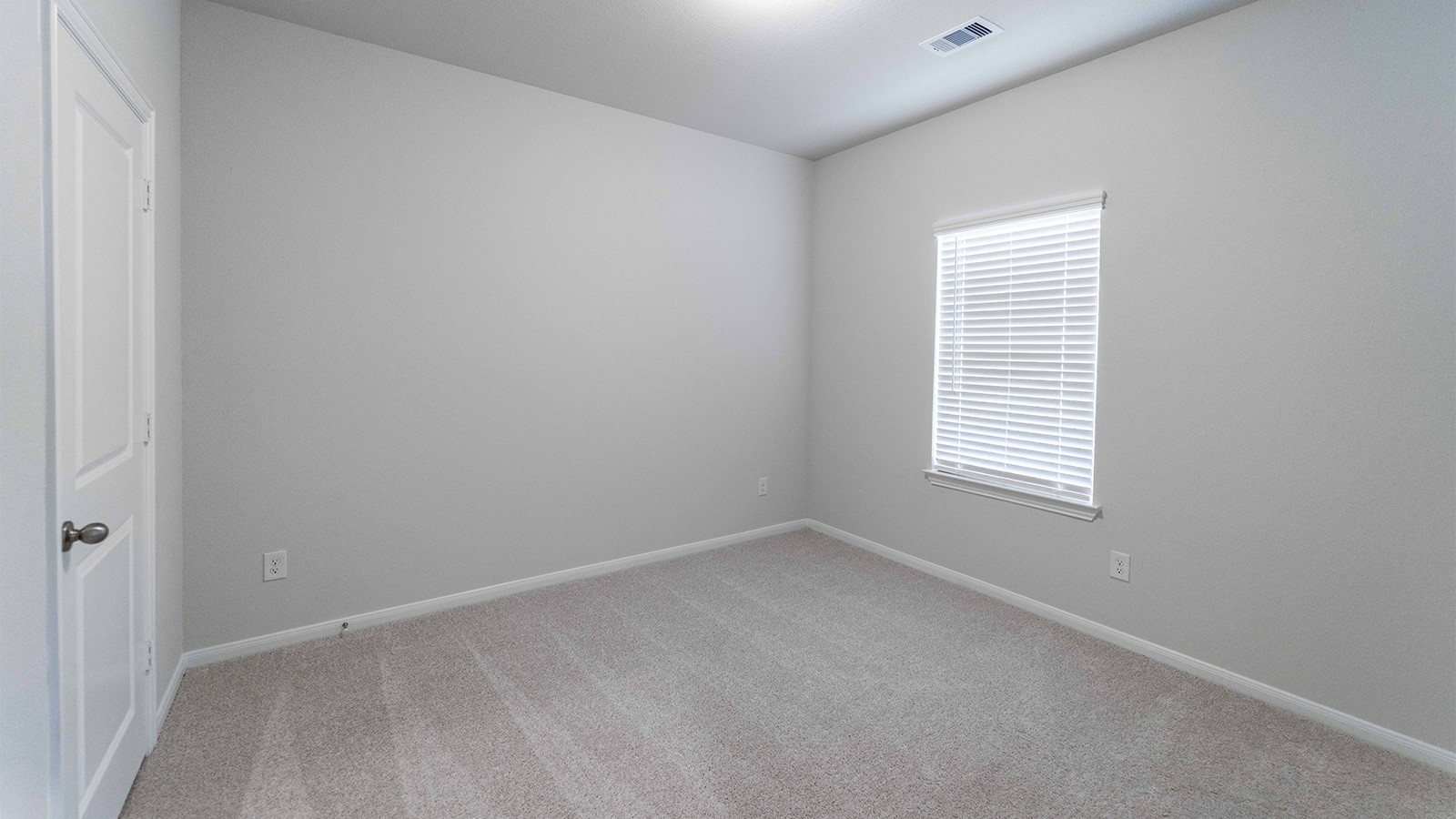 1539 Windrose Bend Angleton, TX 77515 - Photo 12 of 13 a view of an empty room with a window