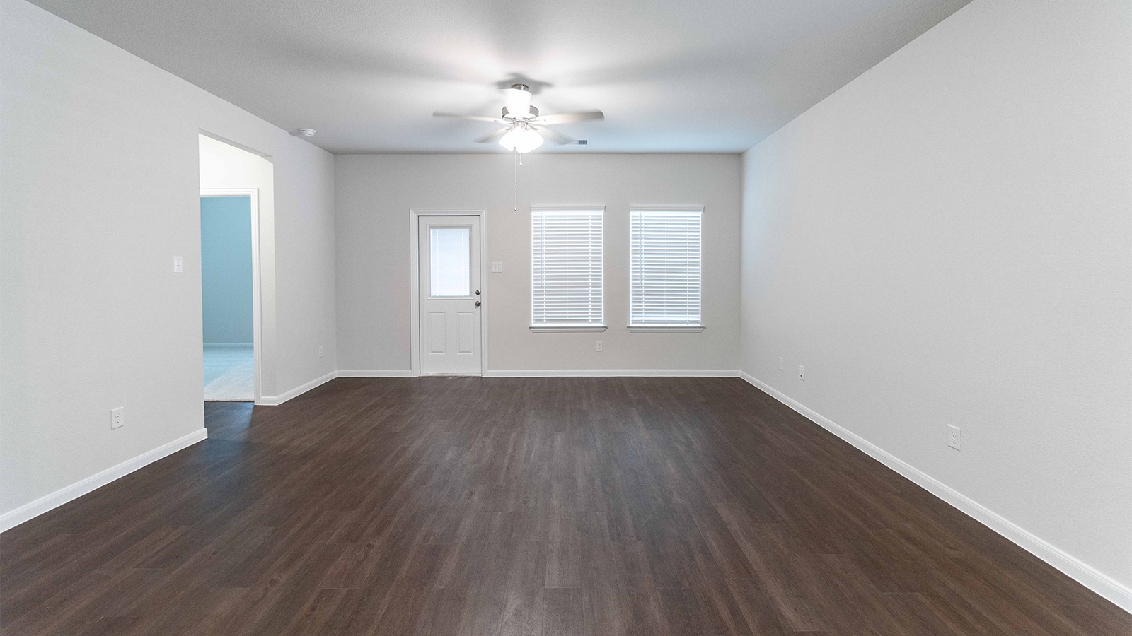 1539 Windrose Bend Angleton, TX 77515 - Photo 6 of 13 an empty room with wooden floor and windows