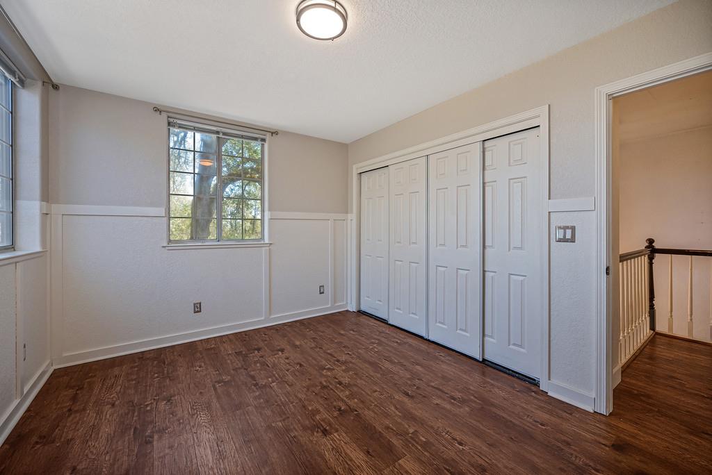 3154 Twin K Road Pilot Hill, CA 95664 - Photo 58 of 89 a view of an empty room with wooden floor and a window