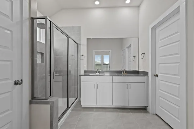 a bathroom with a granite countertop sink mirror and double