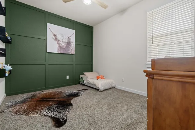 a bedroom with a bed and furniture