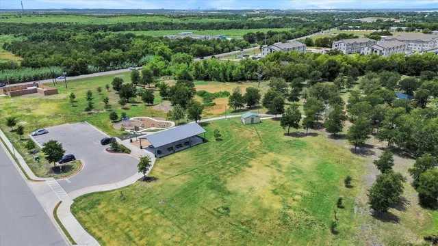 an aerial view of a house with a yard