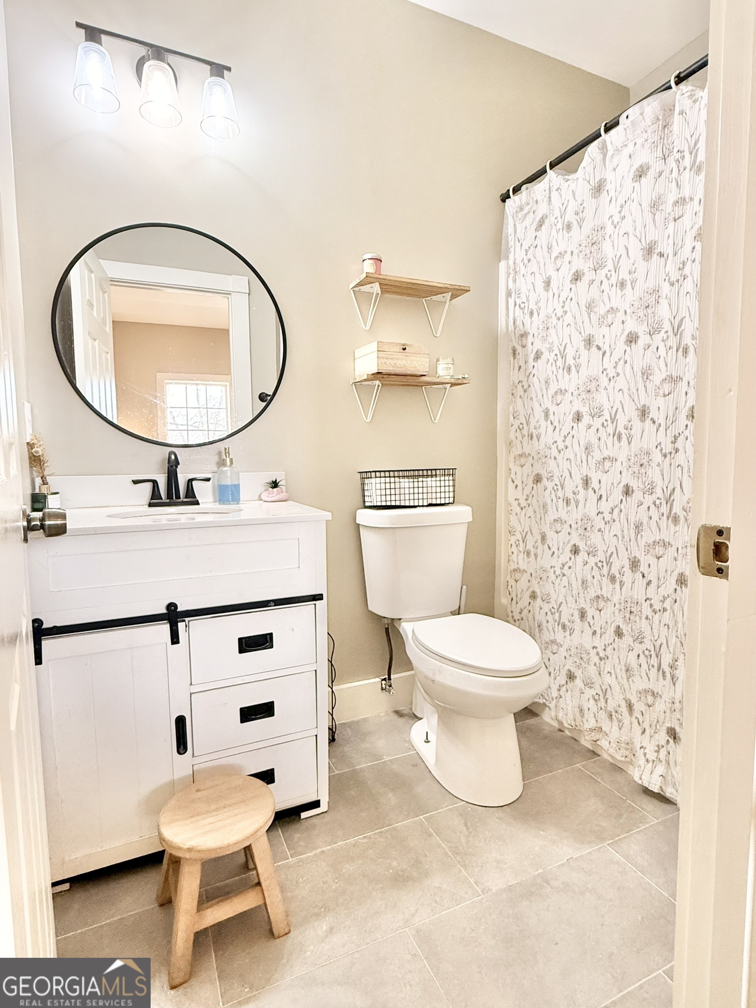 919 West Milner Road Concord, GA 30206 - Photo 21 of 40 a bathroom with a toilet a sink and a mirror
