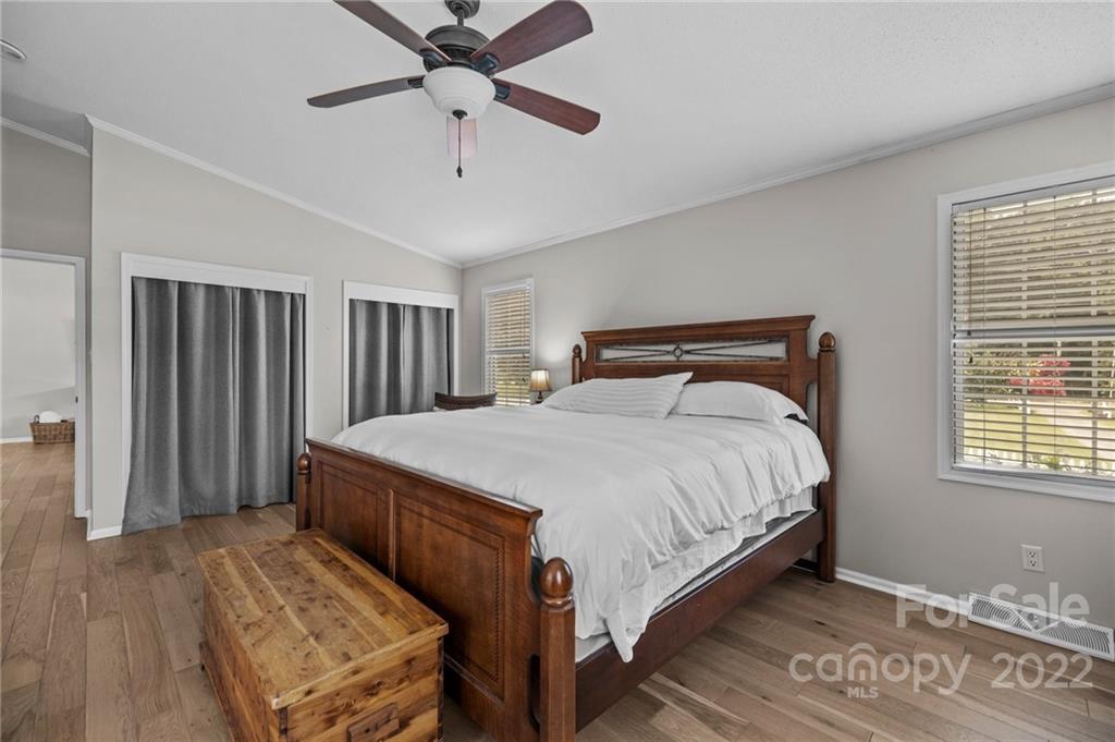 11008 Asbury Chapel Road Huntersville, NC 28078 - Photo 28 of 45 a spacious bedroom with a bed and a window