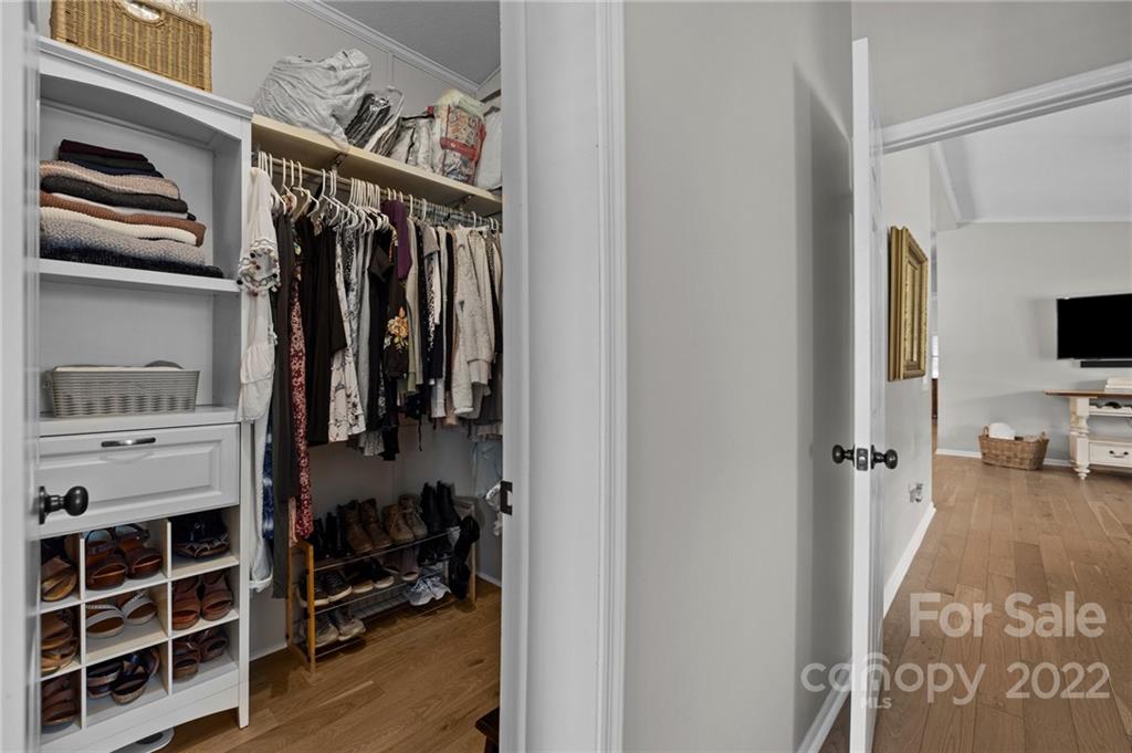 11008 Asbury Chapel Road Huntersville, NC 28078 - Photo 33 of 45 a view of walk in closet with clothes and shoes