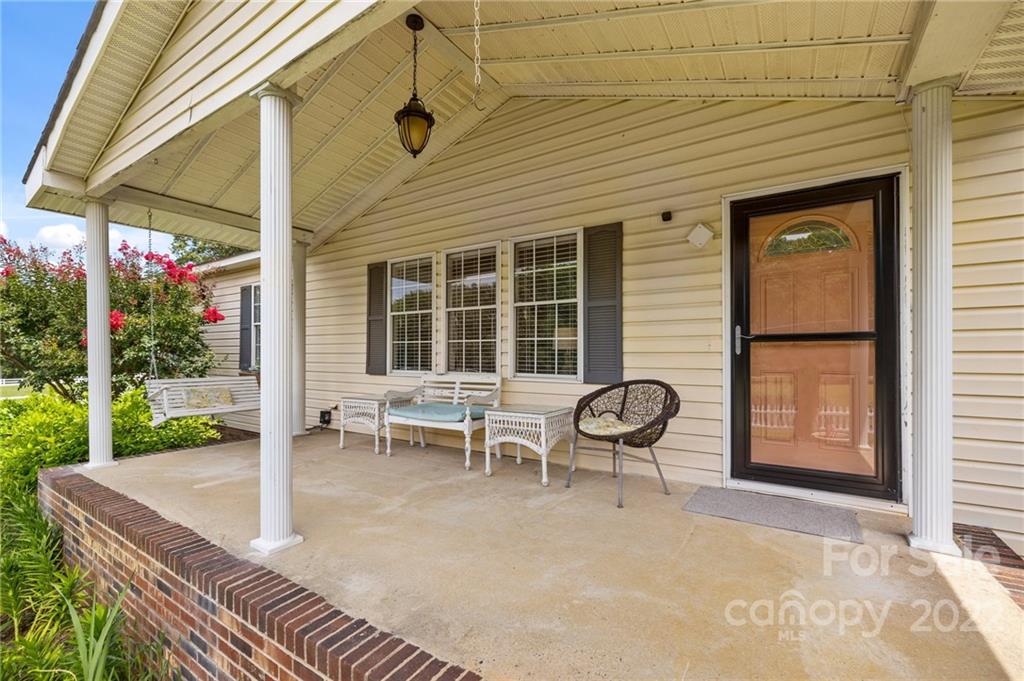 11008 Asbury Chapel Road Huntersville, NC 28078 - Photo 4 of 45 a backyard of a house with barbeque oven table and chairs