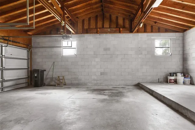 a view of a house with a yard and pathway