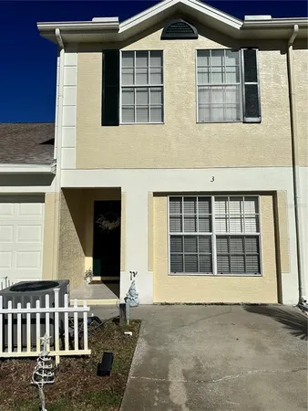 a front view of a house with large windows