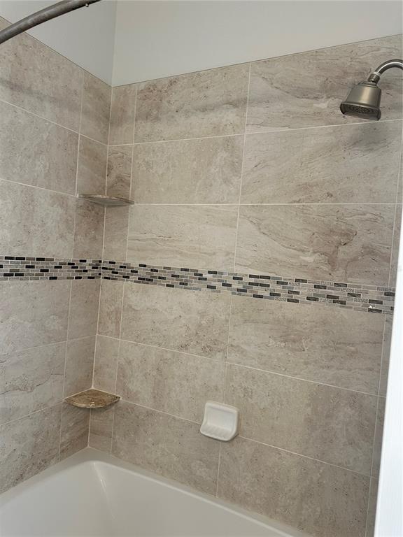 658 Green Valley Road, Unit B3 Palm Harbor, FL 34683 - Photo 22 of 24 a bathroom with a shower
