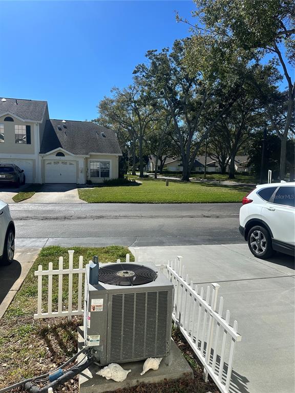 658 Green Valley Road, Unit B3 Palm Harbor, FL 34683 - Photo 24 of 24 a view of a car park in front of house