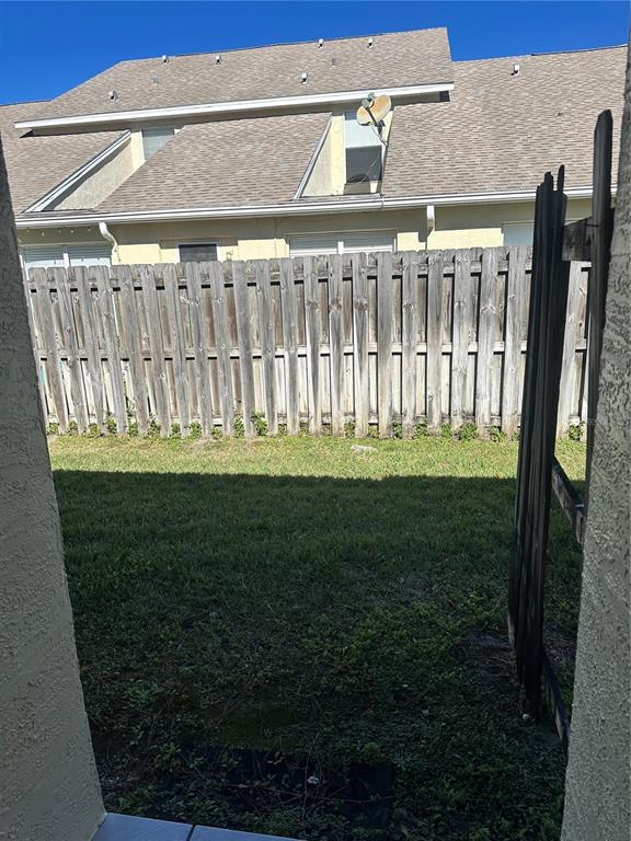 658 Green Valley Road, Unit B3 Palm Harbor, FL 34683 - Photo 10 of 24 a front view of a house with a garden