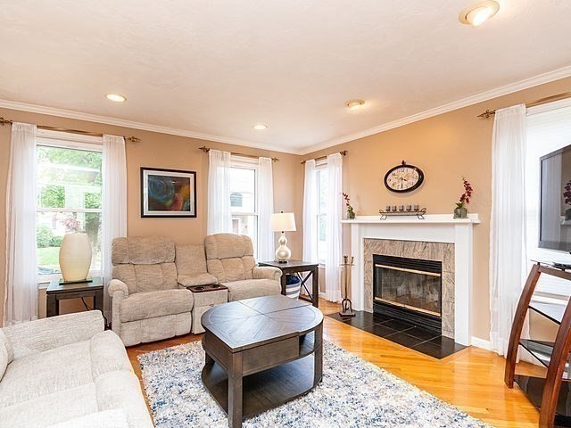 120 Hanson Road Newton, MA 02459 - Photo 12 of 33 a living room with furniture and a fireplace