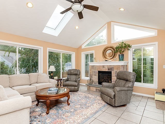 120 Hanson Road Newton, MA 02459 - Photo 14 of 33 a living room with furniture a fireplace and a large window