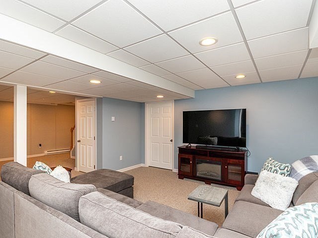 120 Hanson Road Newton, MA 02459 - Photo 19 of 33 a living room with furniture and a flat screen tv