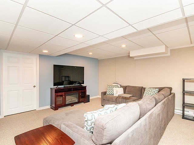 120 Hanson Road Newton, MA 02459 - Photo 20 of 33 a living room with furniture and a flat screen tv
