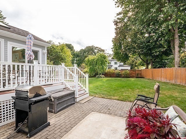 120 Hanson Road Newton, MA 02459 - Photo 23 of 33 a view of a patio with a table chairs and a yard