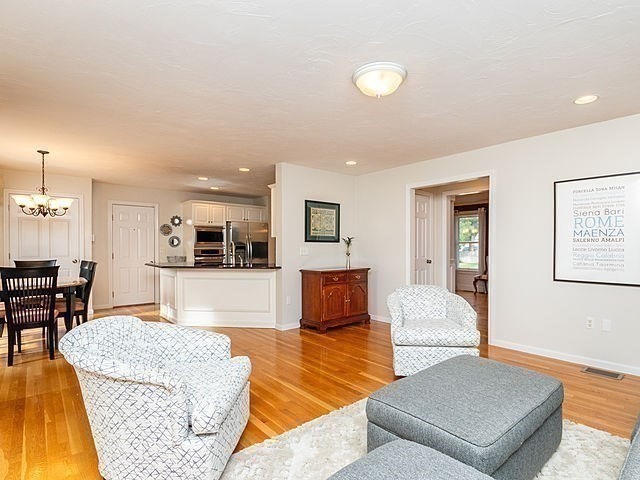 120 Hanson Road Newton, MA 02459 - Photo 28 of 33 a living room with furniture and a table