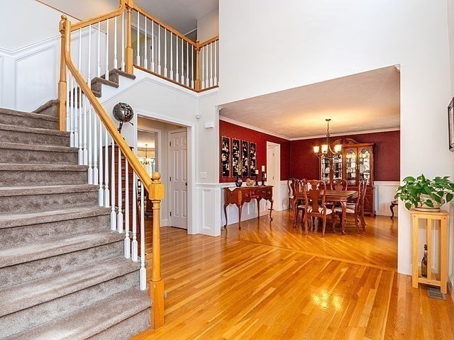 120 Hanson Road Newton, MA 02459 - Photo 3 of 33 a view of entryway dining room and hall with wooden floor