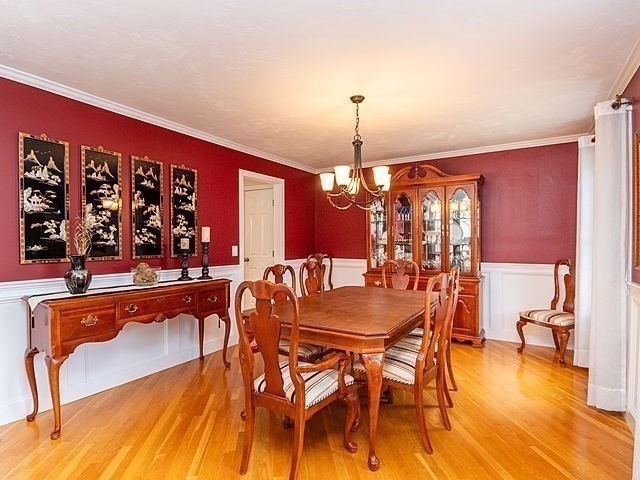 120 Hanson Road Newton, MA 02459 - Photo 4 of 33 a dining room with furniture a chandelier and wooden floor