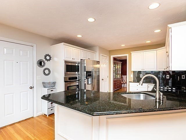 120 Hanson Road Newton, MA 02459 - Photo 5 of 33 a kitchen with stainless steel appliances granite countertop a sink a stove and a refrigerator