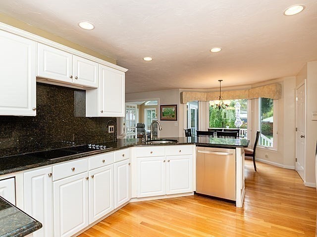 120 Hanson Road Newton, MA 02459 - Photo 6 of 33 a kitchen with granite countertop a sink and cabinets
