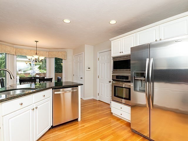 120 Hanson Road Newton, MA 02459 - Photo 7 of 33 a kitchen with stainless steel appliances a refrigerator sink and microwave