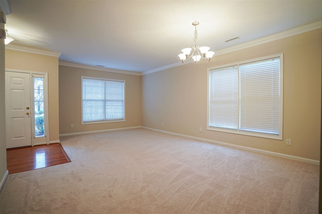 1517 Roaring Rapids Road Raleigh, NC 27610 - Photo 13 of 28 Combination living and dining area at the front of the home. So much natural light and new carpet! Living/Dining Area