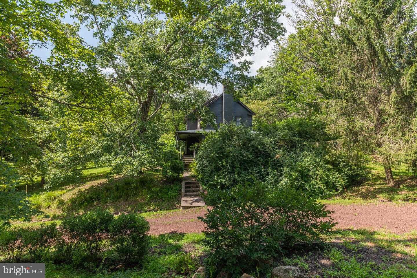 80 Red Cliff Road Upper Black Eddy, PA 18972 - Photo 5 of 70 Tree Story Main Farmhouse nestled on the hillside