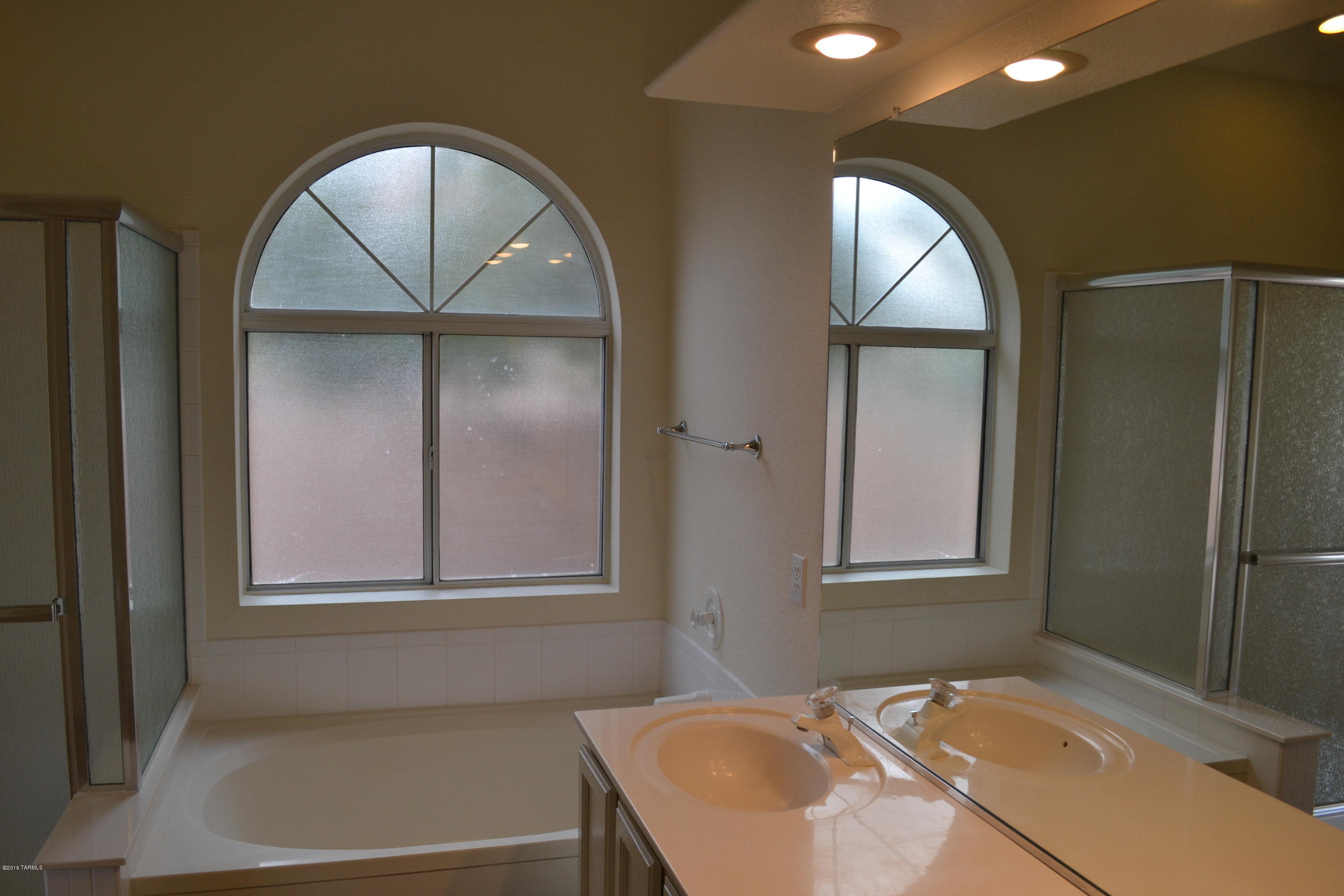 5640 North Cherokee Ridge Road Tucson, AZ 85750 - Photo 15 of 39 a bathroom with a sink and a mirror
