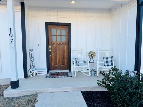 a living room with lots of furniture and a wooden floor
