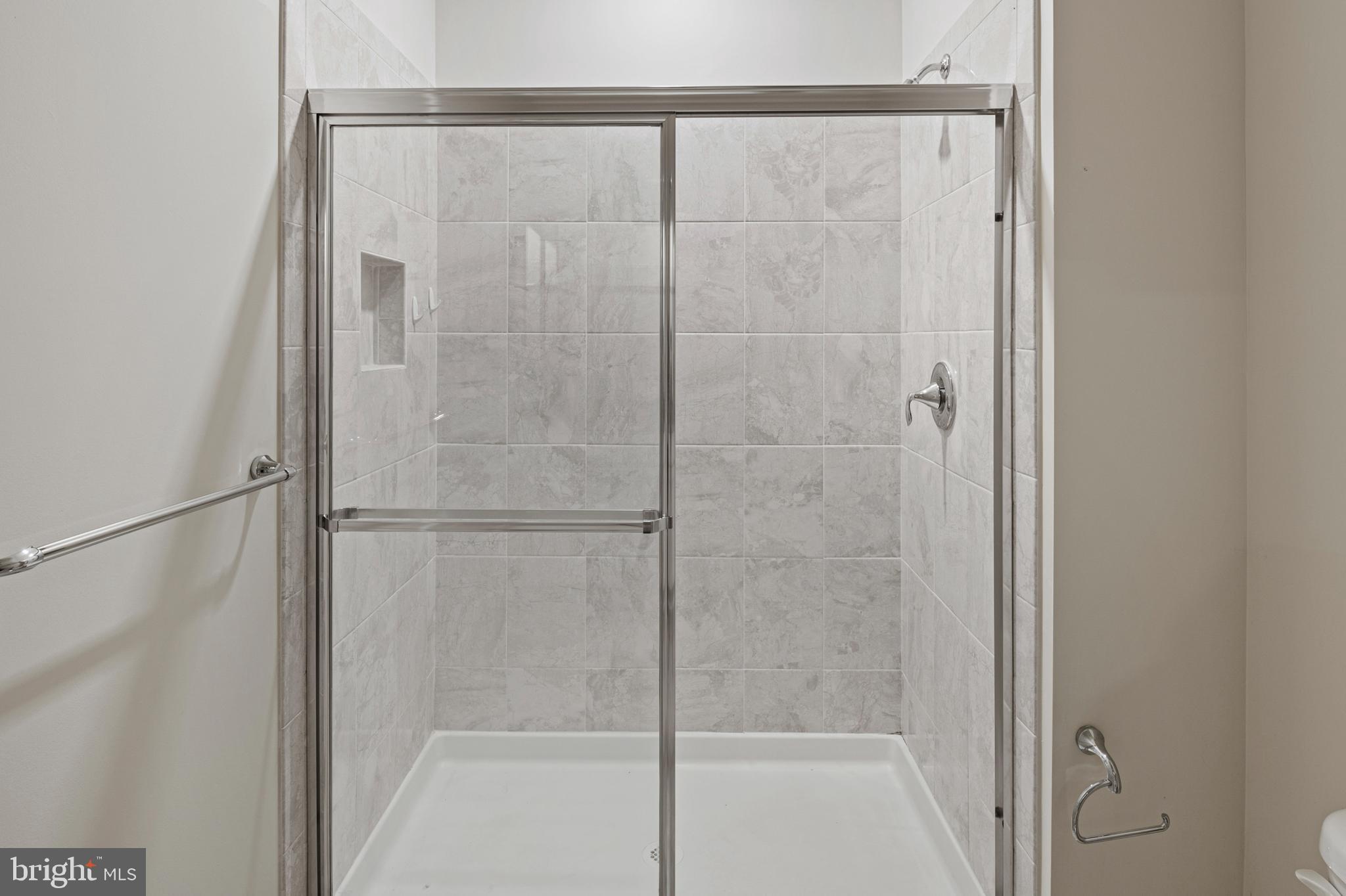 10530 Resort Road, Unit 110 Ellicott City, MD 21042 - Photo 15 of 21 a bathroom with a glass shower door