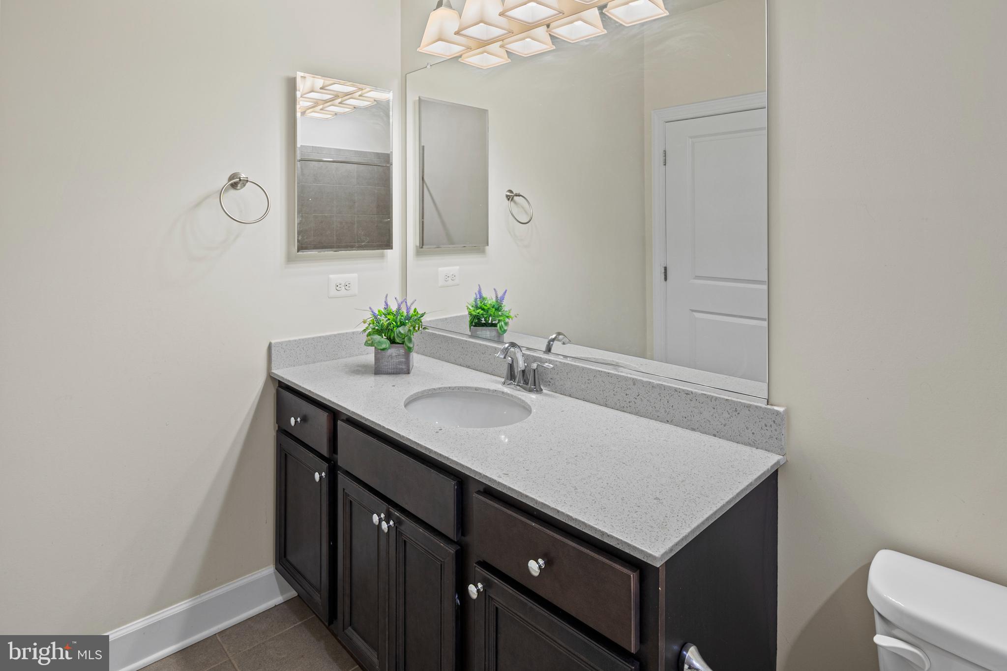 10530 Resort Road, Unit 110 Ellicott City, MD 21042 - Photo 18 of 21 a bathroom with a sink and a mirror