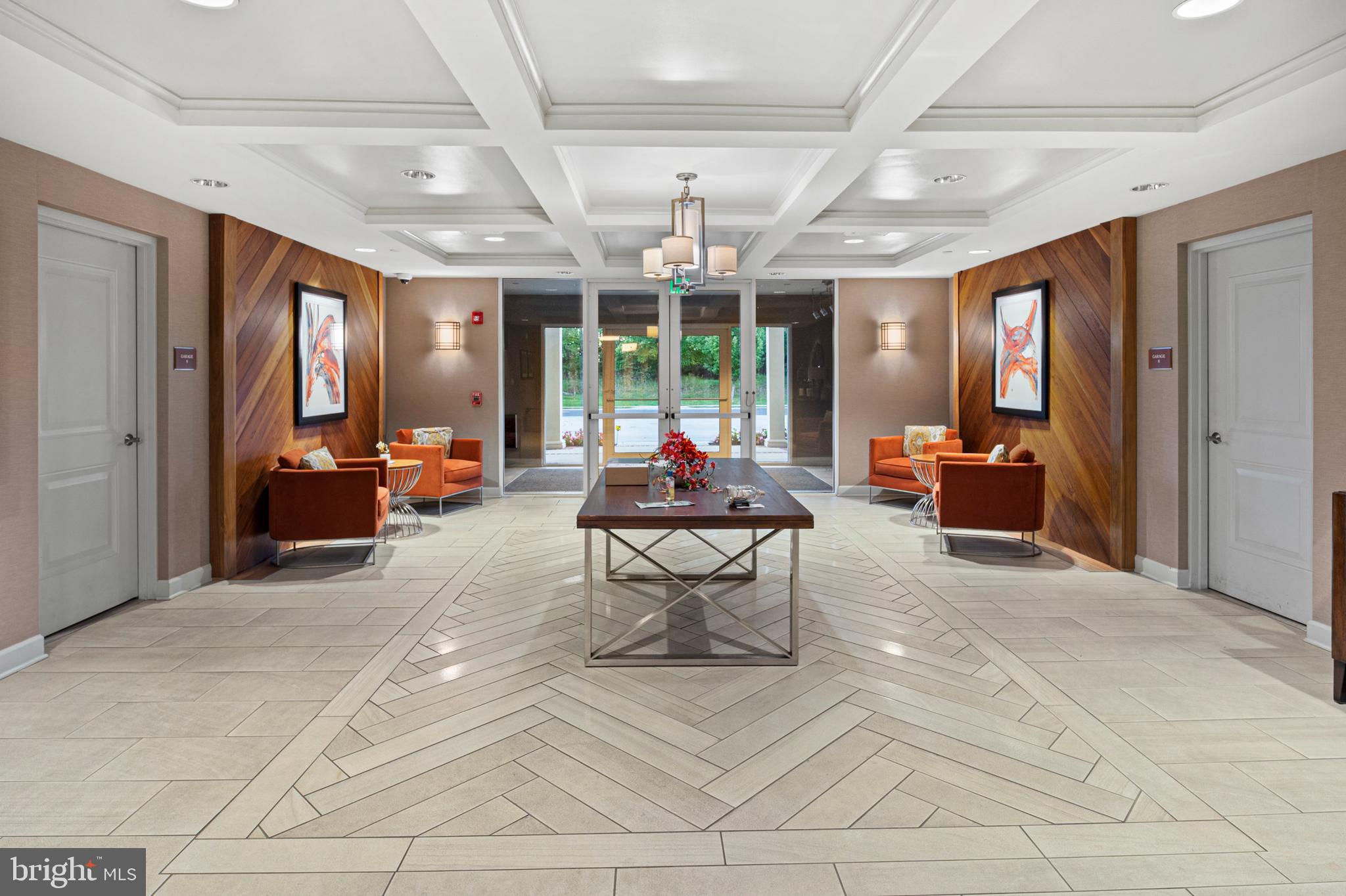 10530 Resort Road, Unit 110 Ellicott City, MD 21042 - Photo 3 of 21 a living room with patio furniture and a large window