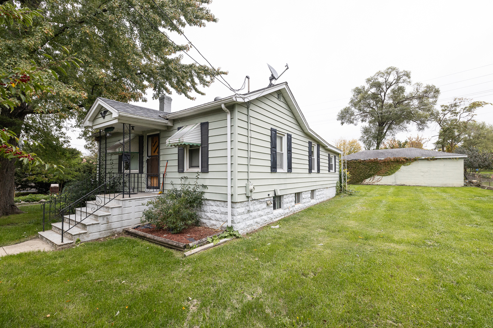 706 Clinton Street Lockport, IL 60441 - Photo 2 of 12 a view of a house with a yard and sitting area