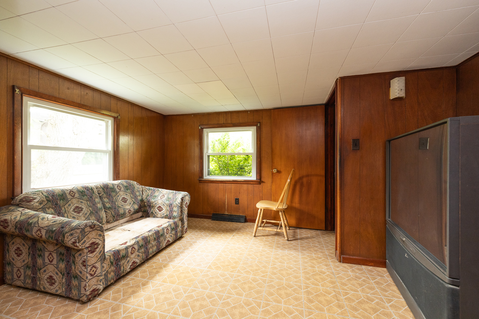 706 Clinton Street Lockport, IL 60441 - Photo 7 of 12 a living room with a bed furniture and a window